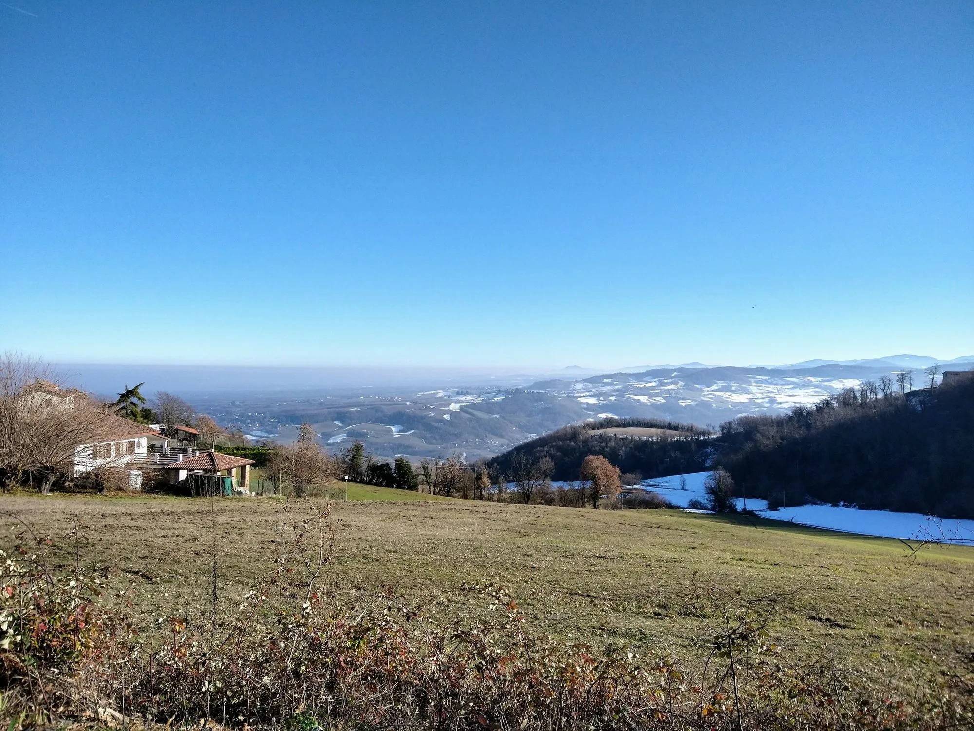Blue skies and fog in the distance.
