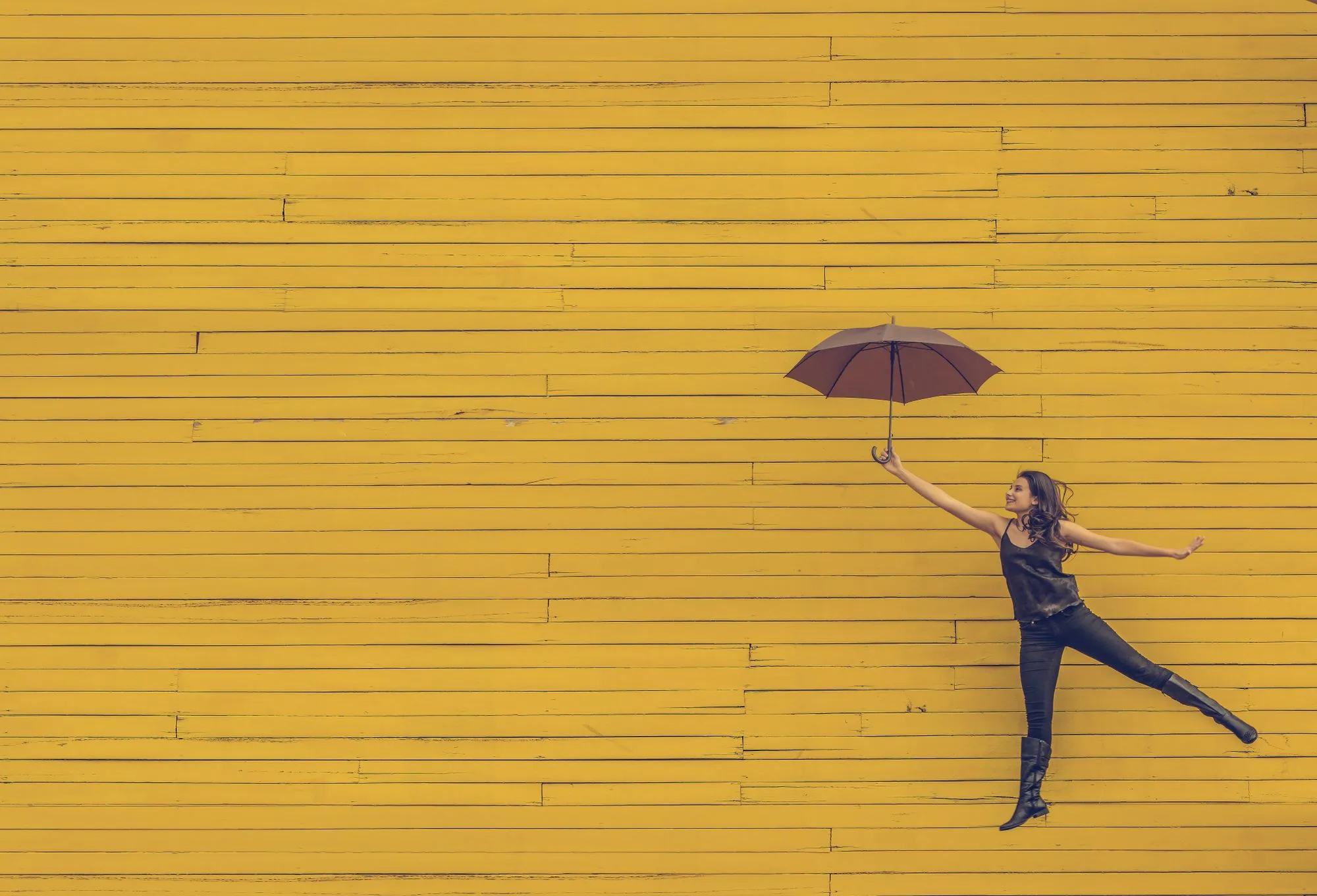 Woman with umbrella - Photo by Edu Lauton
